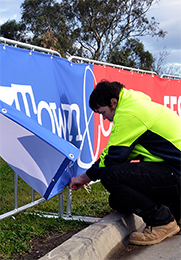 Fairs: Upright portable crowd barricade systems with advertising signage banners fitted for event displays at a Town and Country Festival