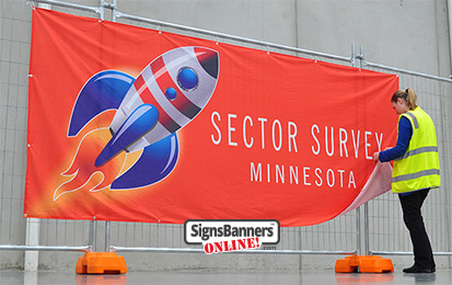 Custom orange banner sign with rocket design and person MINNESOTA MN USA.