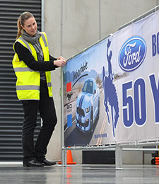 Fairs: This excellent example of barrier signage for Wyoming shows how modern canvas banner signage can be used for advertising. The print is a custom example of imagery, texts and logos.