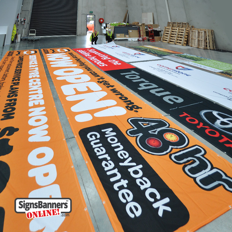 Signs Banners Online Staff Inspecting Banners and Signs During Various Stages of Production