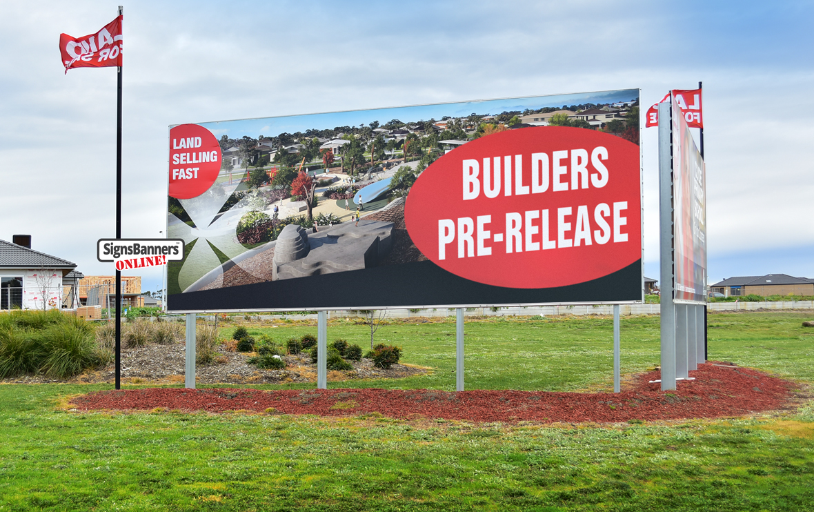 Land and Realty builders billboard with flags