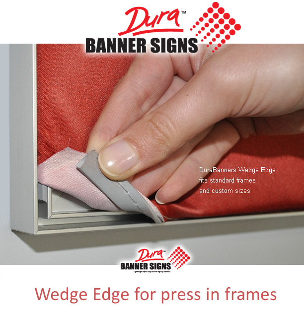 Fingers showing the press in features of the fabric banner fitted to aluminium frame surround. This makes signage swap over easy and is typically used in retail environments and for store branding changes.