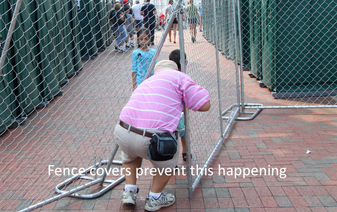 Man breaking through a fence at an event