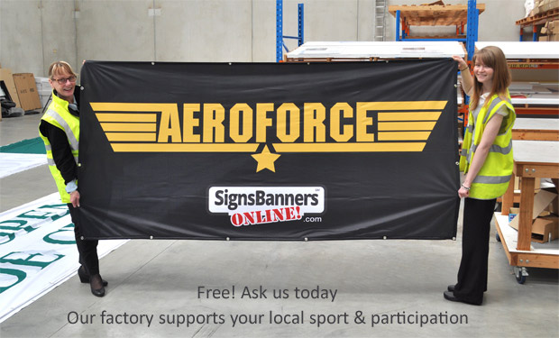 Our factory supports your team with banners. Ask us today. Here the girls are holding up a team banner with logo.