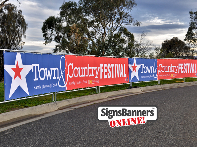 Fairs: Upright portable crowd barricade systems with advertising signage banners fitted for event displays at a Town and Country Festival