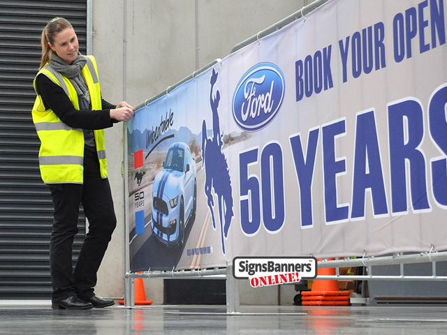 Fairs: This excellent example of barrier signage for Wyoming shows how modern canvas banner signage can be used for advertising. The print is a custom example of imagery, texts and logos