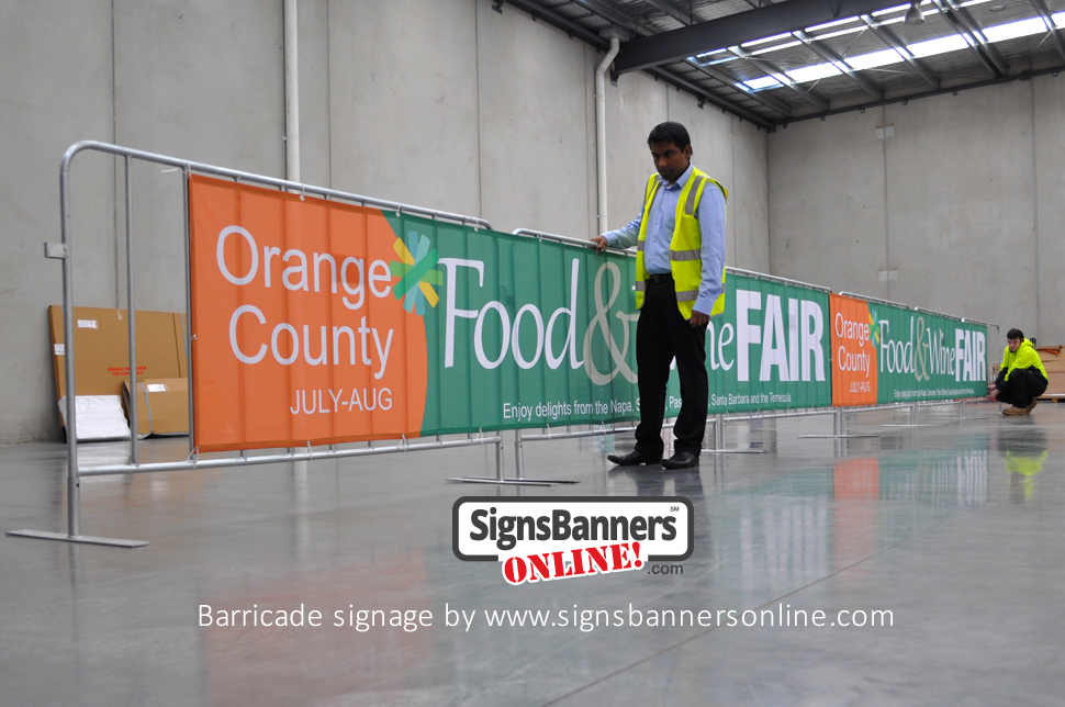 Barricade signage. Barricade signage is a popular form to promote events and logos and is now very cheap. The benefits include NO SCRATCH which means that your banner signs can be stored and used annually like this example for Orange County CA