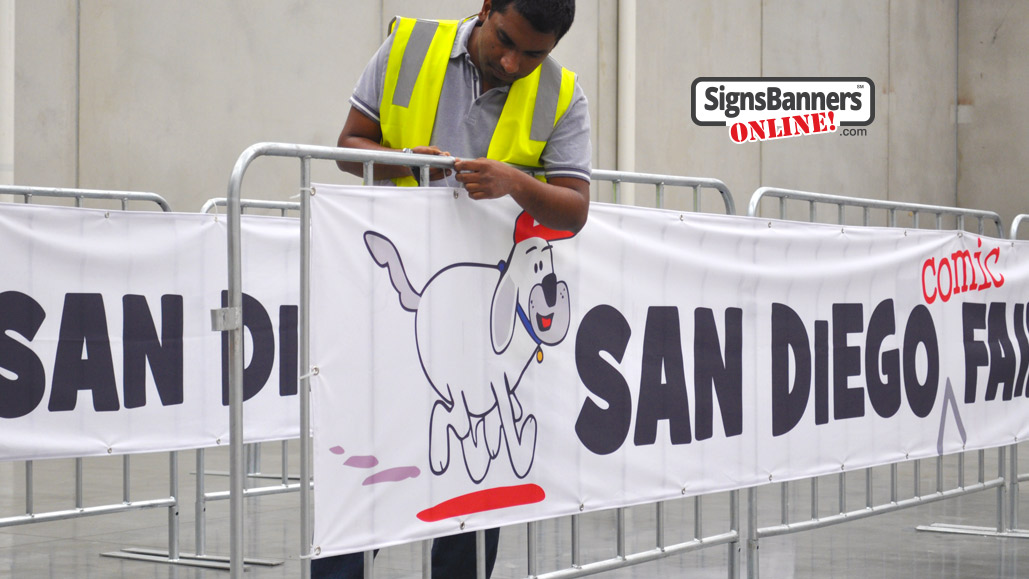 fitment of the banner sign to the lift away portable fence at the fair registration queue line.