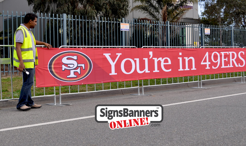 Event signage fixed to the barricades - 49ers San Francisco event promotion