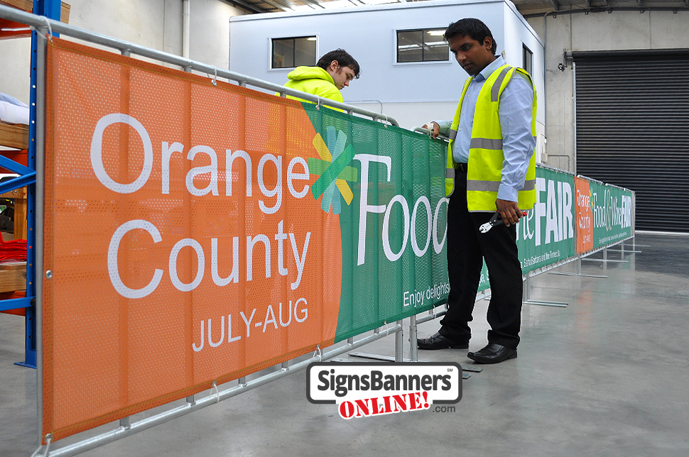 Factory showing the california orange county event management of FAIR Food & Wine. These portable barricade fences with signs are popular at events in california.