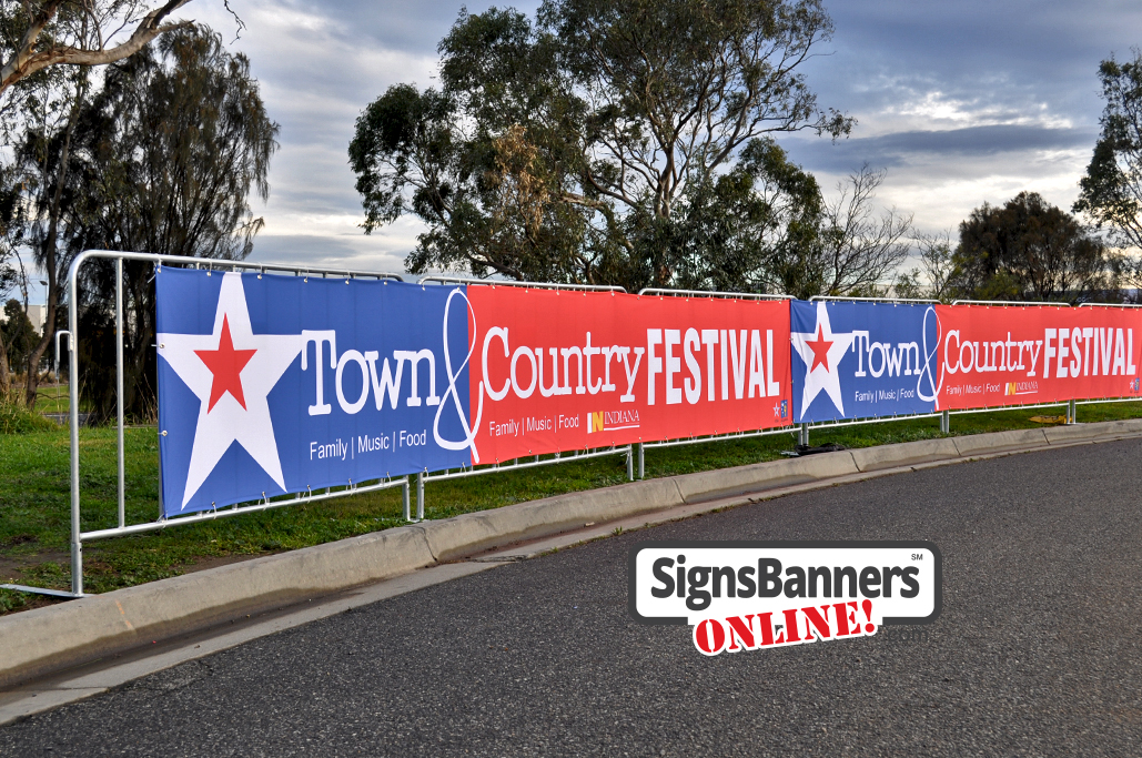 Upright portable crowd barricade systems with advertising signage banners fitted for event displays at the festival USA.