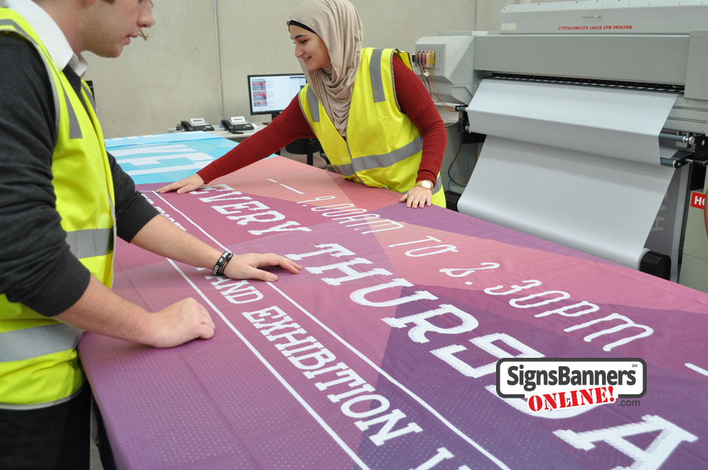 Working in the print shop making signs and banners for USA markets