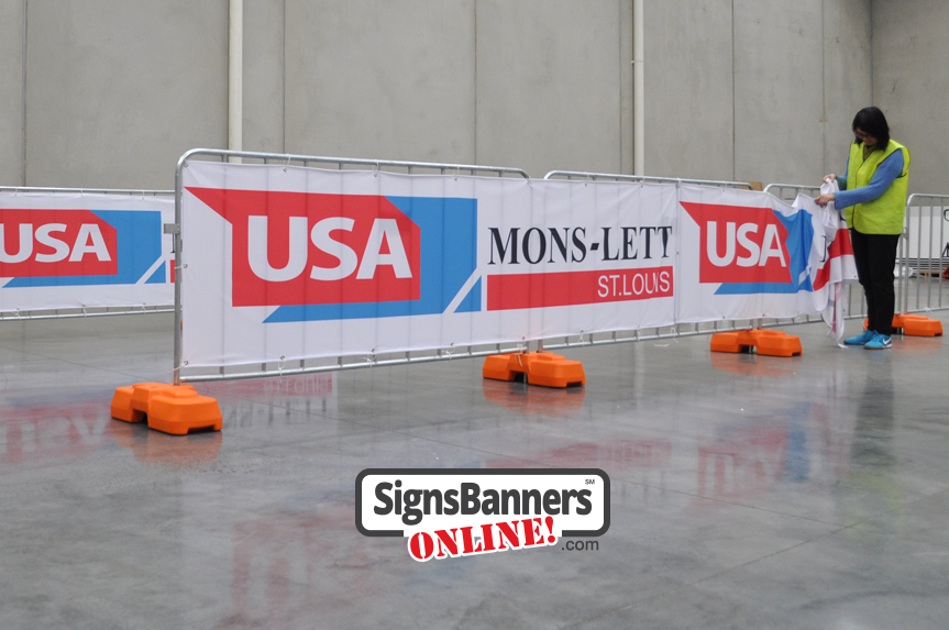 Event Crew. Showing the ease that any deployment crew can put up and down the signage using these flexible sign pieces.