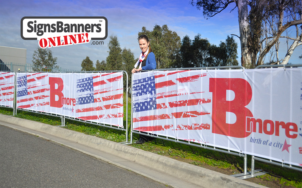 The image shows the complete fencing with banner printing fitted. The US Flag motif and logos provide a great backdrop for what customers can purchase. Custom size, design and completed creative.