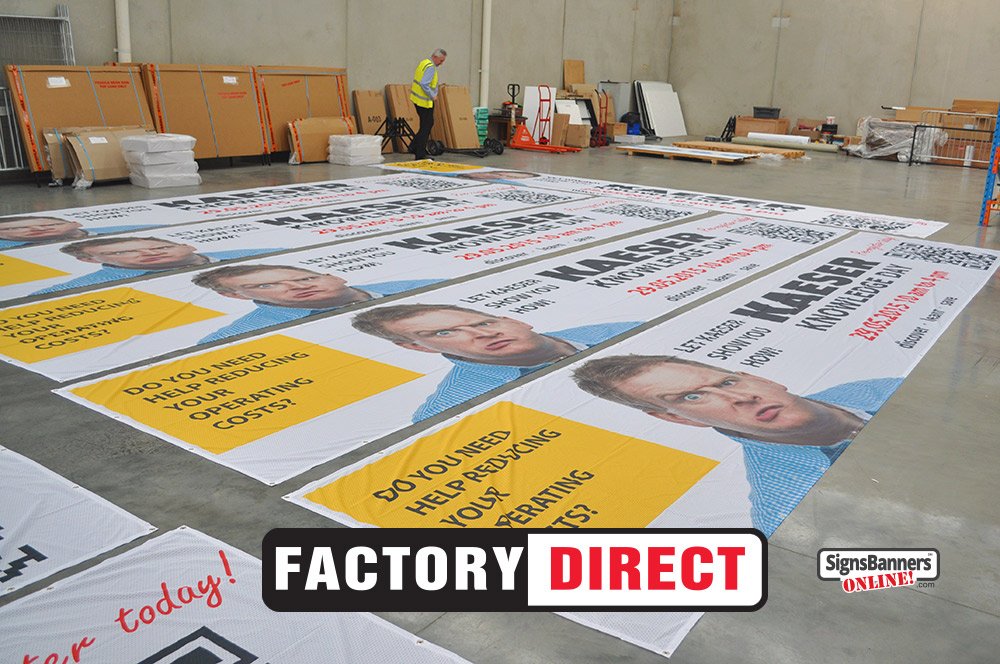 Photo inside the banner sign factory showing banners being made