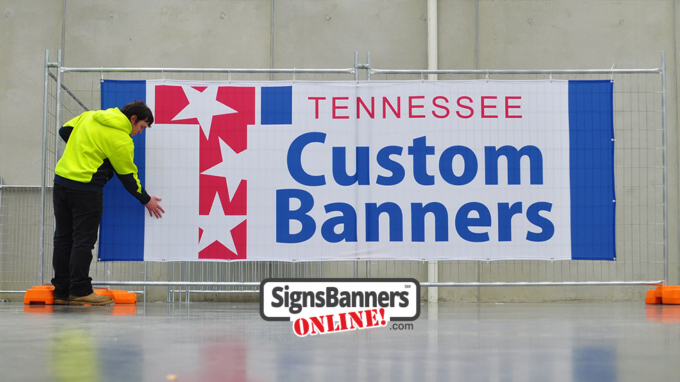 Workman standing on the other side of the Tennessee custom banners sign example