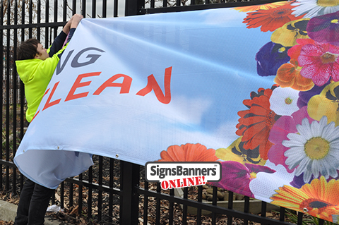 Hey it's windy whilst putting up the banner sign